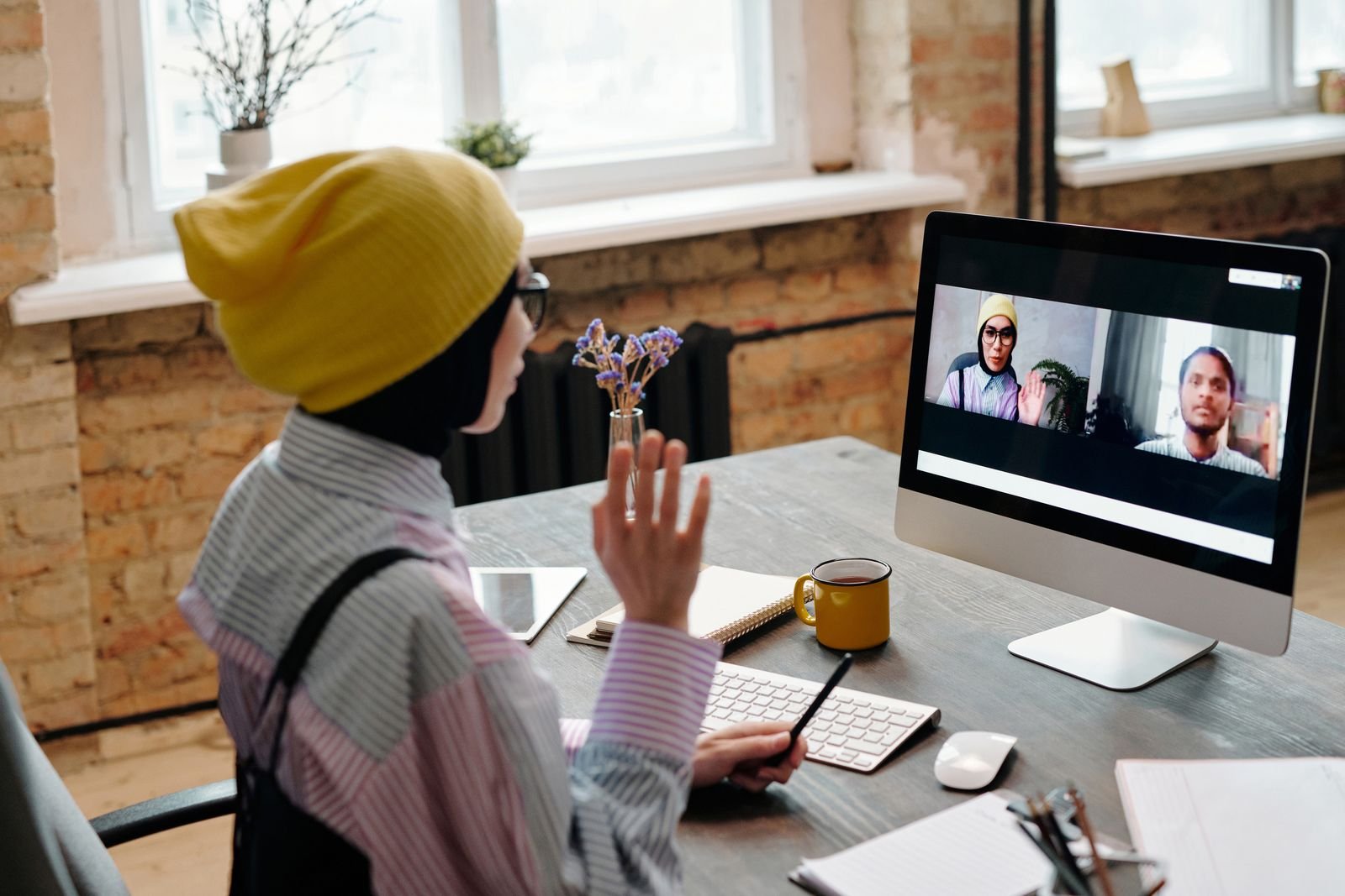 Remote employee joining a video meeting from her home office