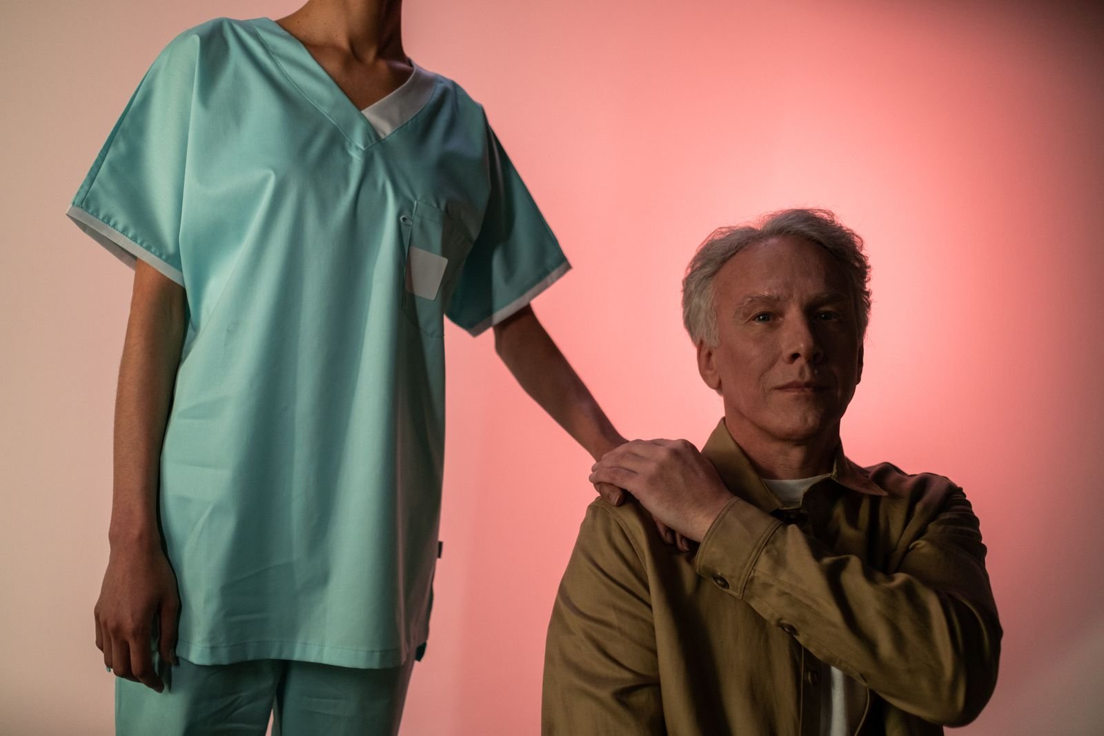 Nurse holding the hand of an older patient